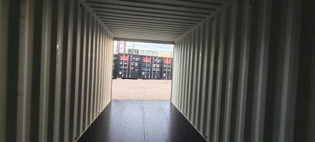 Marine plywood floor running the length of an empty 20ft container