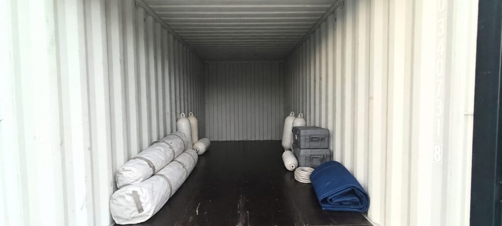 Sail bags, fenders and equipment cases stored inside a 20ft container at PalmaBox